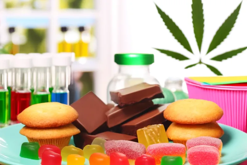 Colorful and artistic representation of various cannabis edibles.